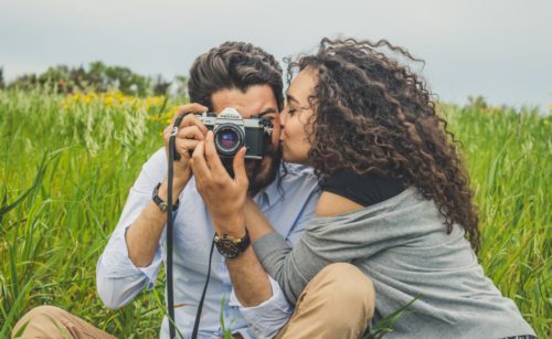 woman kissing photographer