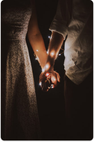 holding hands with lights